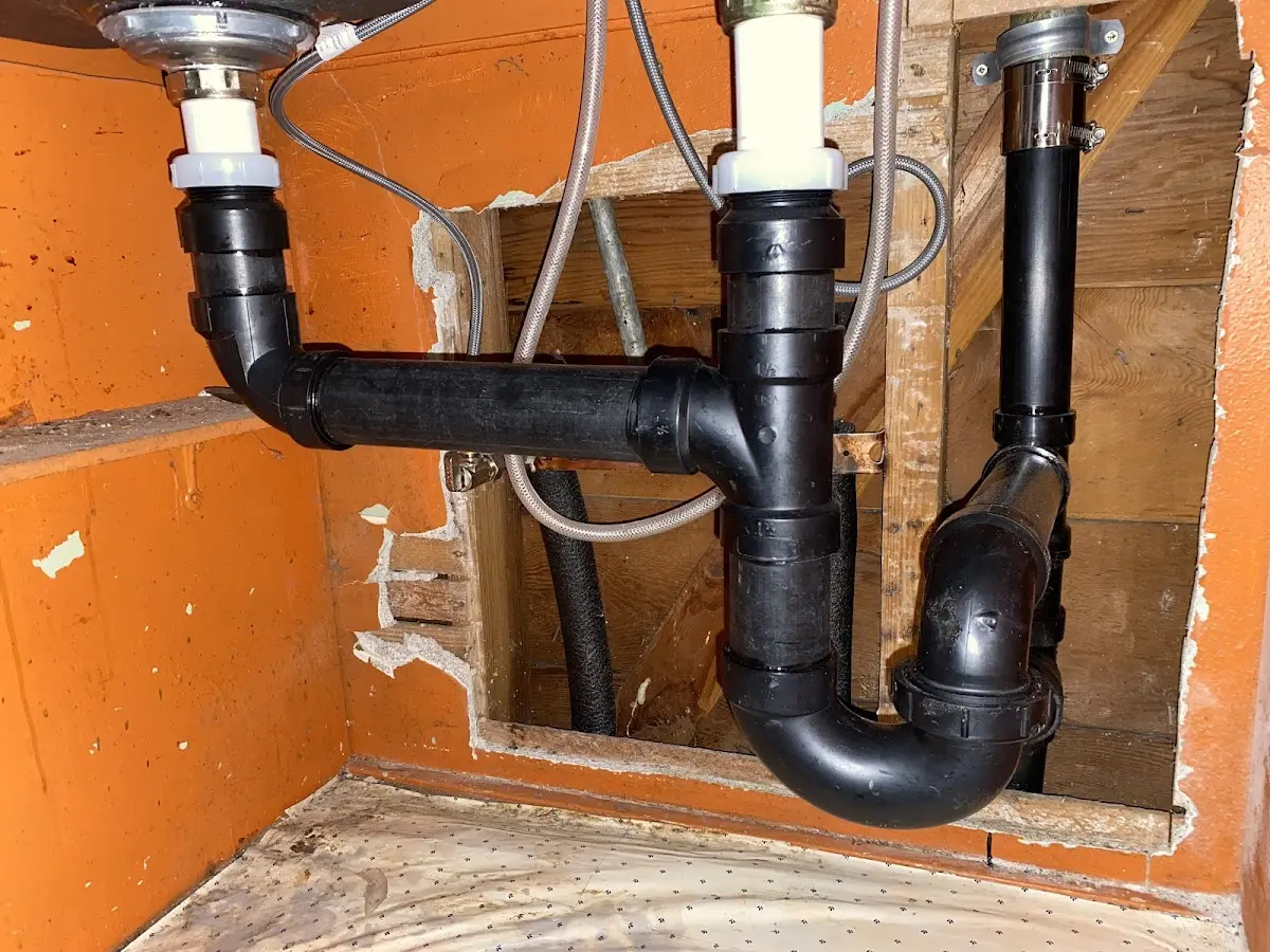 Professional Garbage Disposal Repair equipment and tools on the job in Litchfield Beach